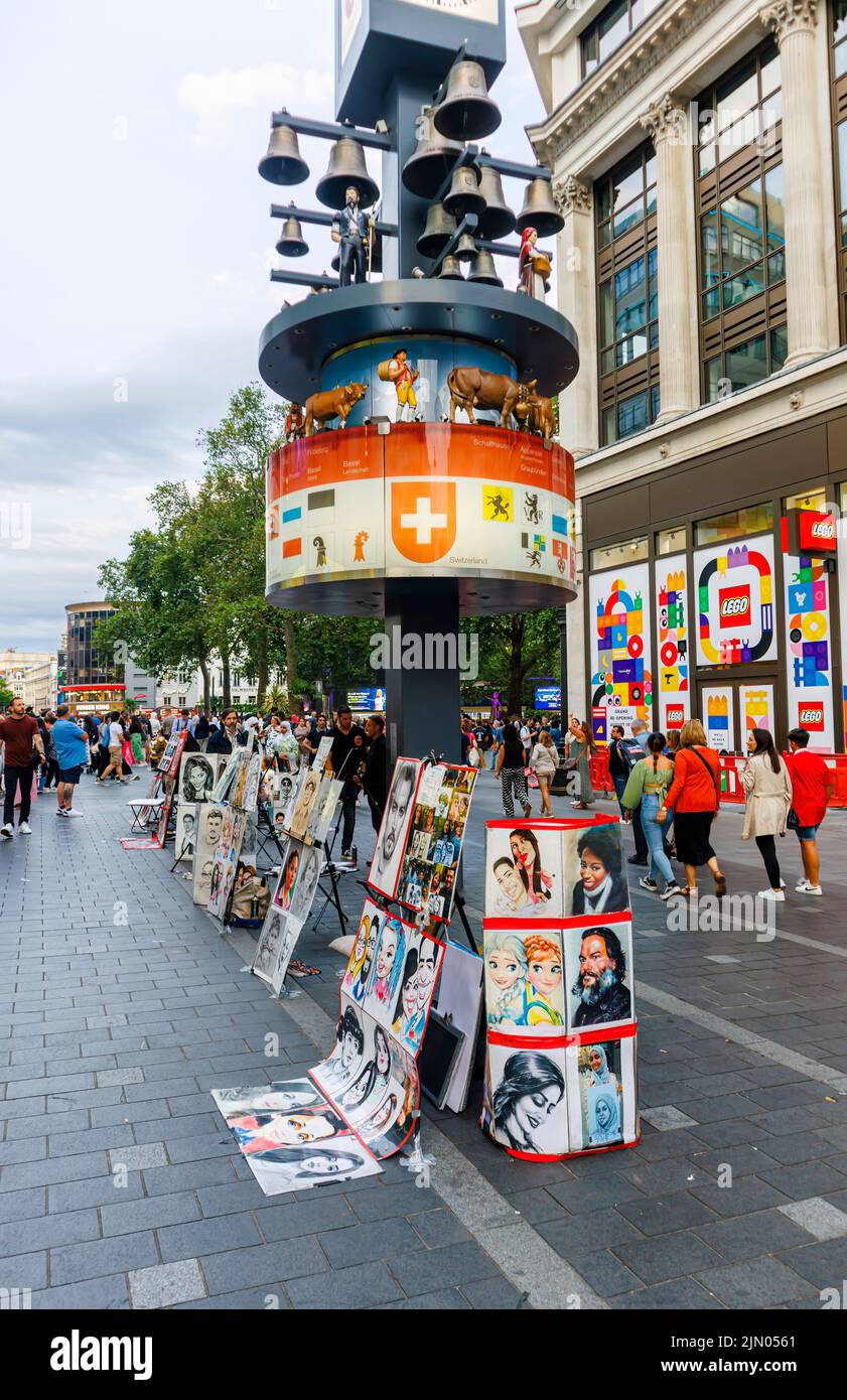Typical colourful  caricature drawings on display for tourist souvenirs in Leicester Square in London's West End Stock Photo