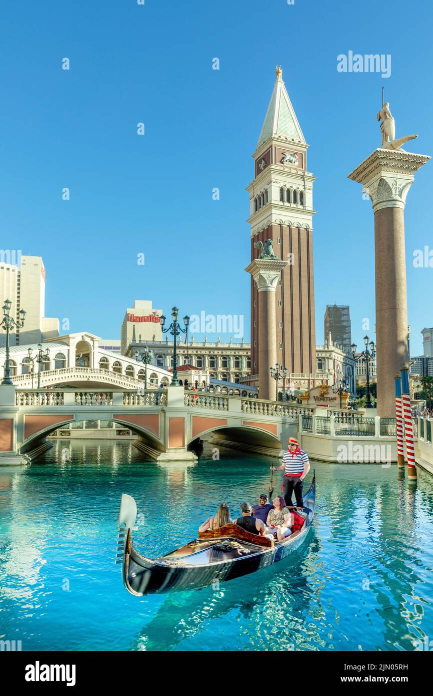 Las Vegas, USA - May 24, 2022: people enjoy a gondola ride at the Hotel and Casino The Venetian with singing gondolieres. Stock Photo
