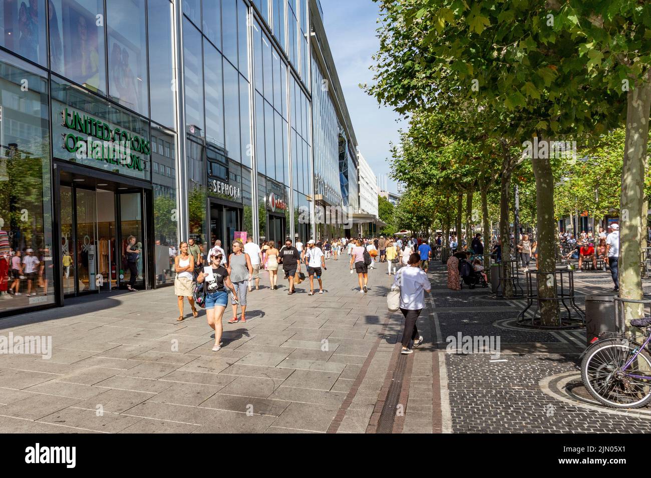 Frankfurt, Germany - August 2, 2022: people enjoy walking along the shopping street Zeil in the pedestrian zone. Stock Photo