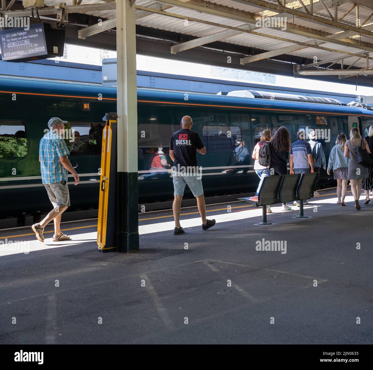People on the platform at Plymouth Railway Station on a hot sunny Day Stock Photo