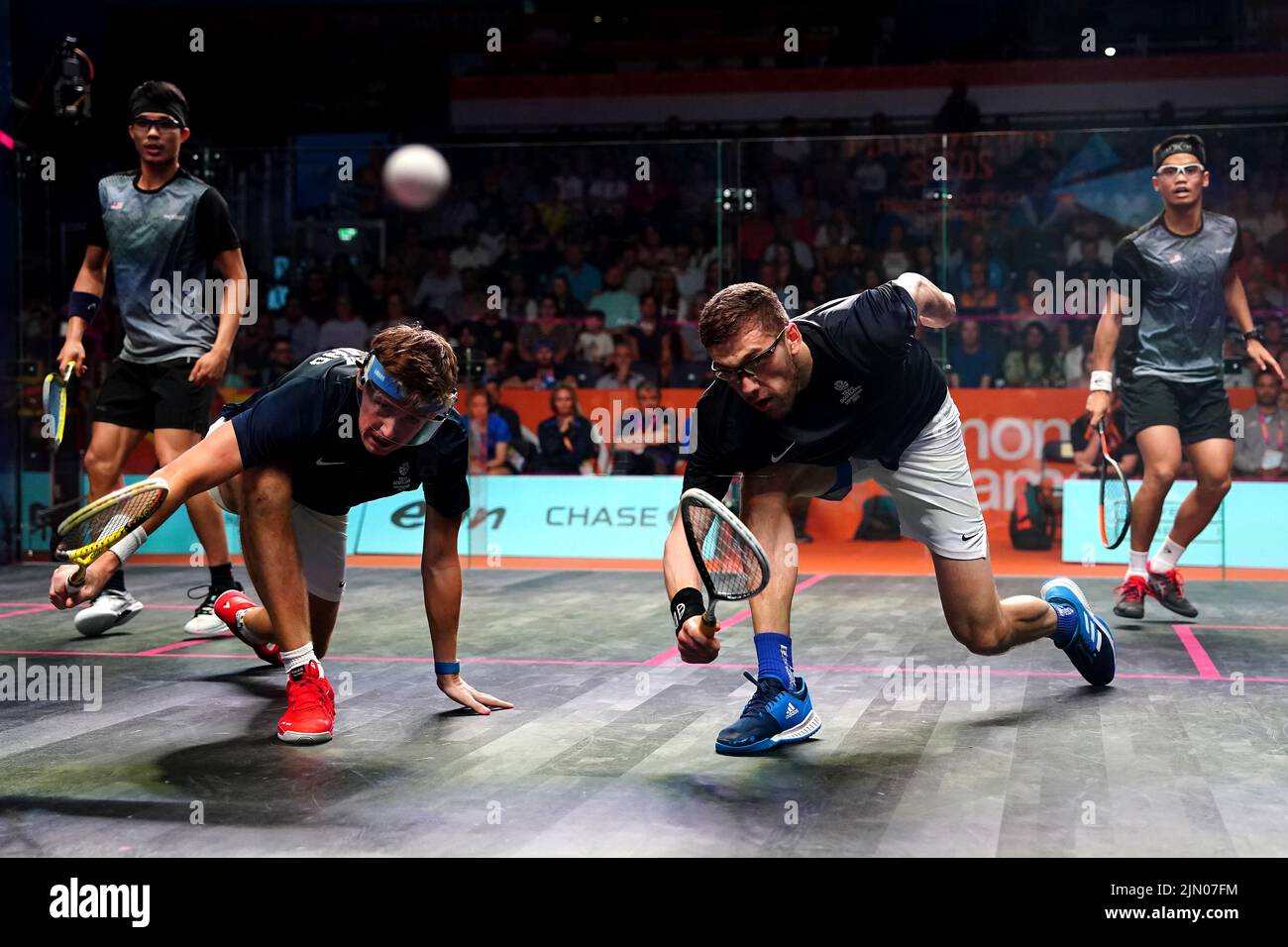 Scotland's Greg Lobban (second left) and Rory Stewart during the Men's Squash Doubles Bronze Medal Match against Malaysia's Yow Eain and Chee Wern Yuen at the University of Birmingham Hockey and Squash Centre on day eleven of the 2022 Commonwealth Games in Birmingham. Picture date: Monday August 8, 2022. Stock Photo