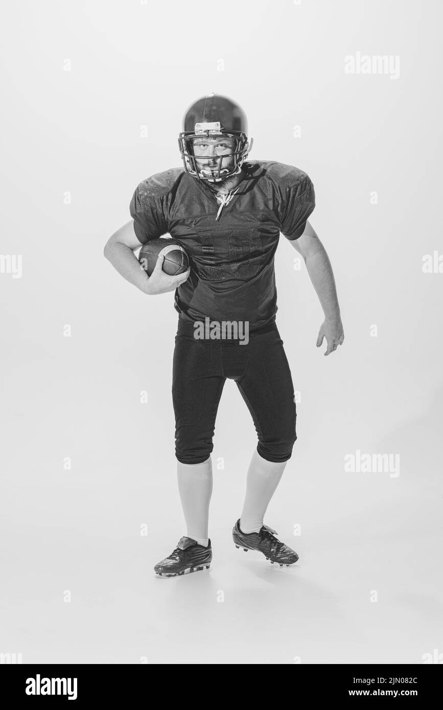 Black and white portrait of american football player in vintage style