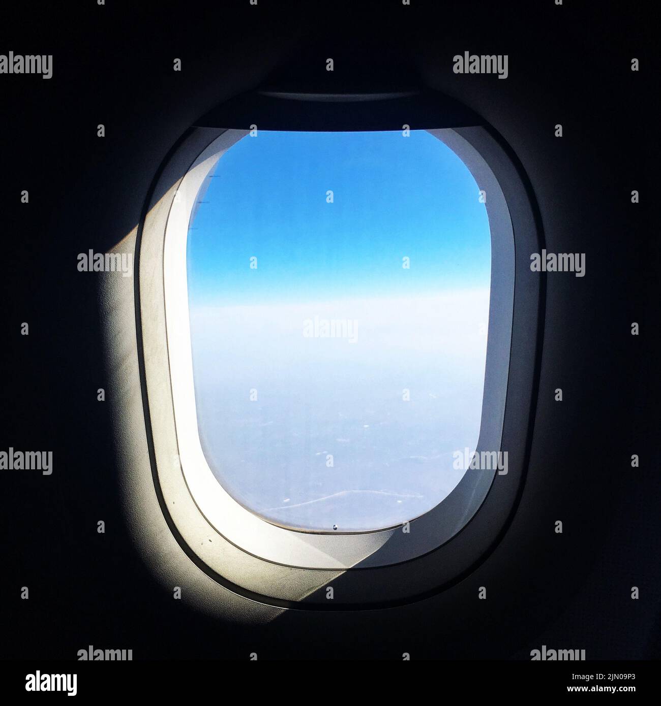 The blue sunny sky and clouds captured from the airplane window Stock ...