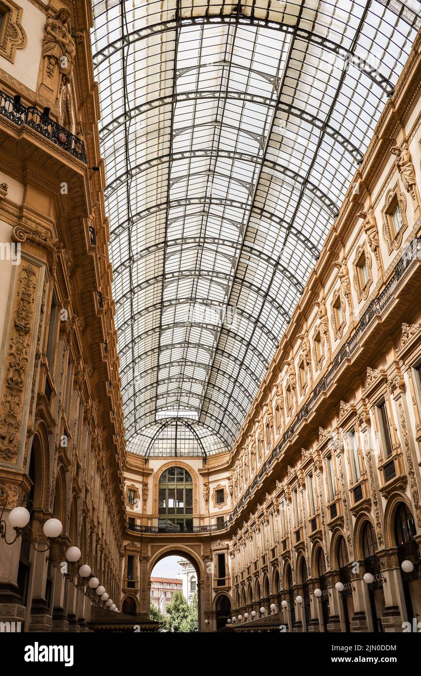 Milan, Italy - 25 June, 2022: Vertical Photo of Galleria Vittorio Emanuele II. Beautiful View of Oldest Shopping Gallery in Lombardy. Stock Photo
