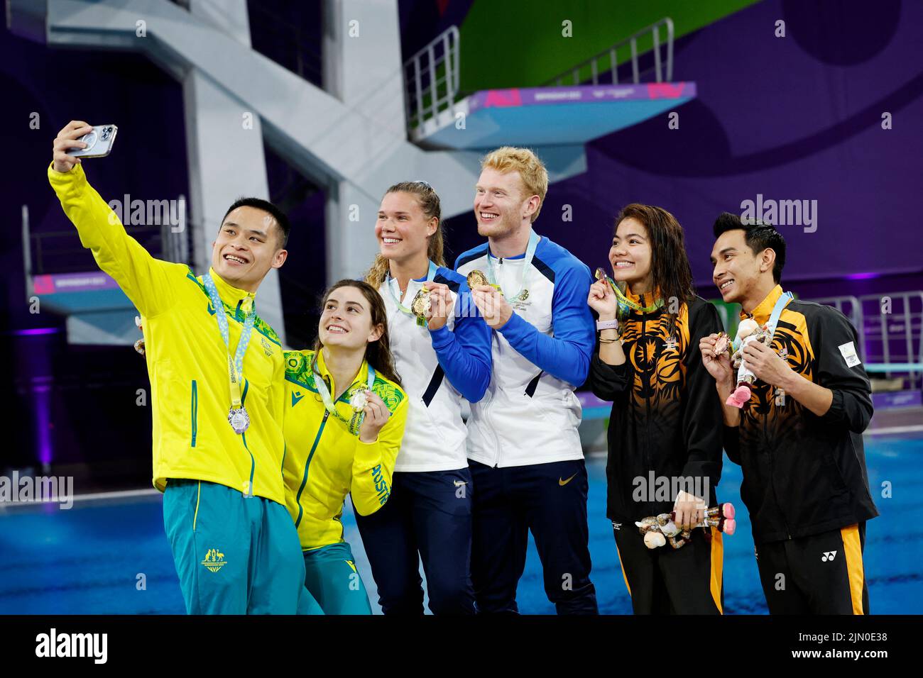 Commonwealth Games - Diving - Mixed Synchronised 3m Springboard - Medal Ceremony - Sandwell Aquatics Centre, Birmingham, Britain - August 8, 2022 Gold medallists Scotland's Grace Elizabeth Reid and James Philip Heatly celebrate on the podium alongside silver medallists Australia's Shixin Li and Maddison Keeney and bronze medallists Malaysia's Nur Dhabitah Binti Sabri and Muhammad Syafiq Bin Puteh during the medal ceremony REUTERS/Stefan Wermuth Stock Photo