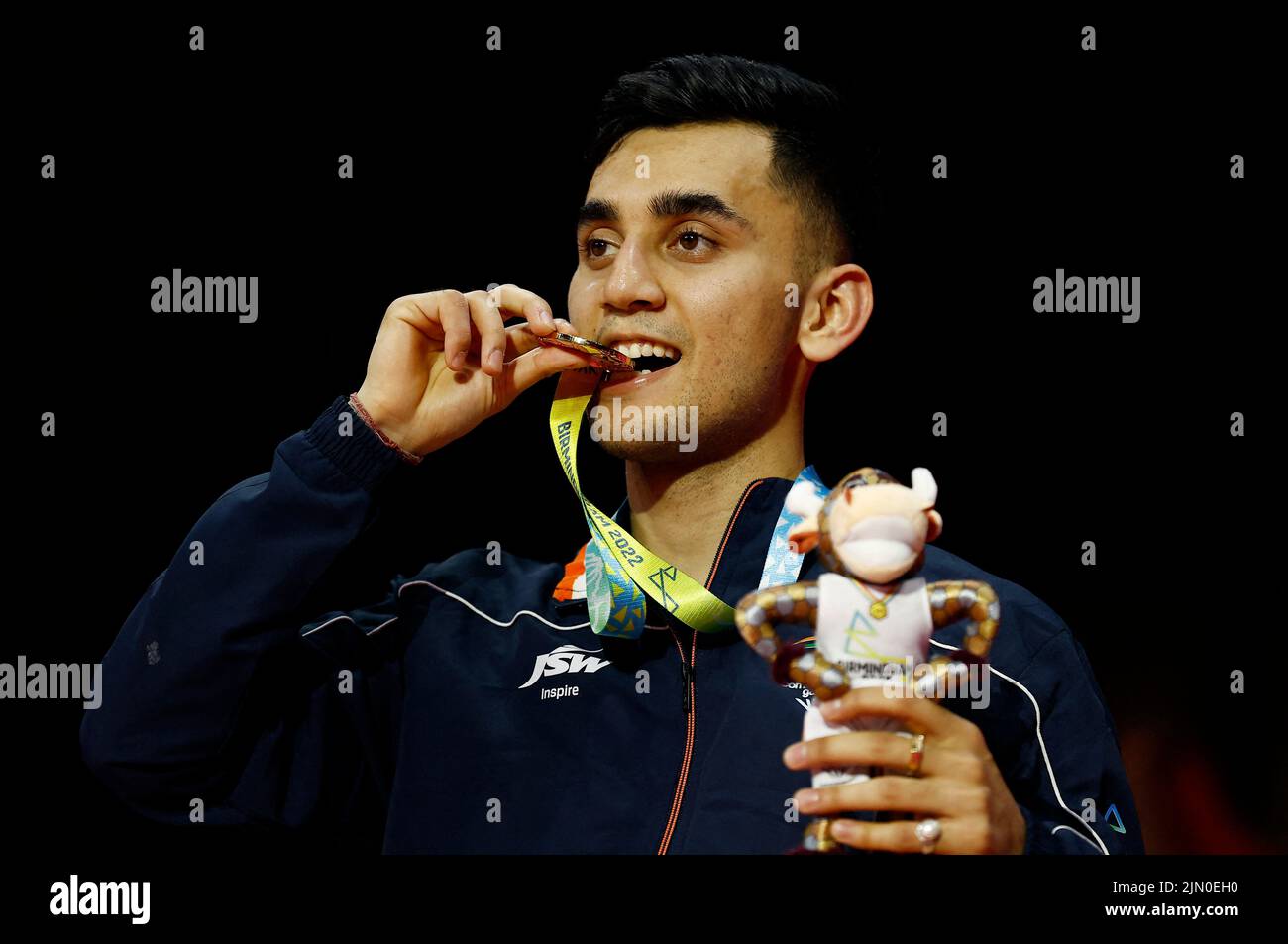 Commonwealth Games - Badminton - Men's Singles - Medal Ceremony - The NEC Hall 5, Birmingham, Britain - August 8, 2022  Gold Medallist India's Lakshya Sen celebrates on the podium during the medal ceremony REUTERS/Jason Cairnduff Stock Photo