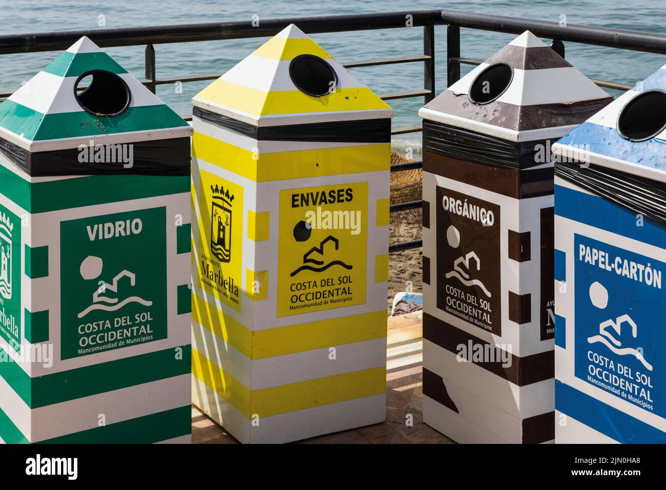 Segregated waste bins.  Marbella, Costa del Sol, Malaga Province, Andalusia, southern Spain. Stock Photo