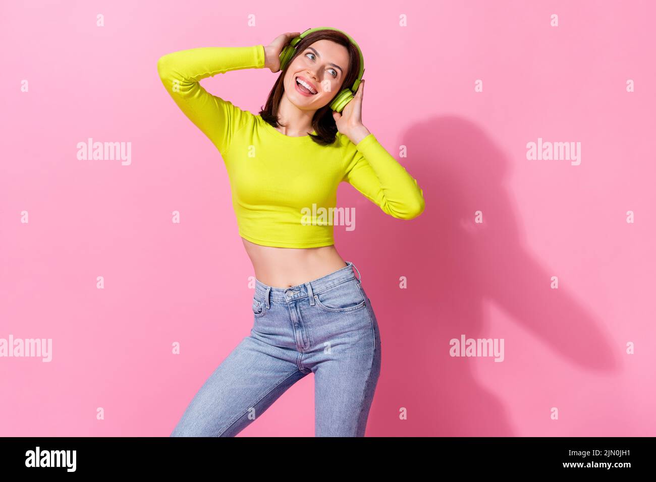 Portrait of satisfied joyful youth girlish lady has free time good mood relax look empty space isolated on pink color background Stock Photo
