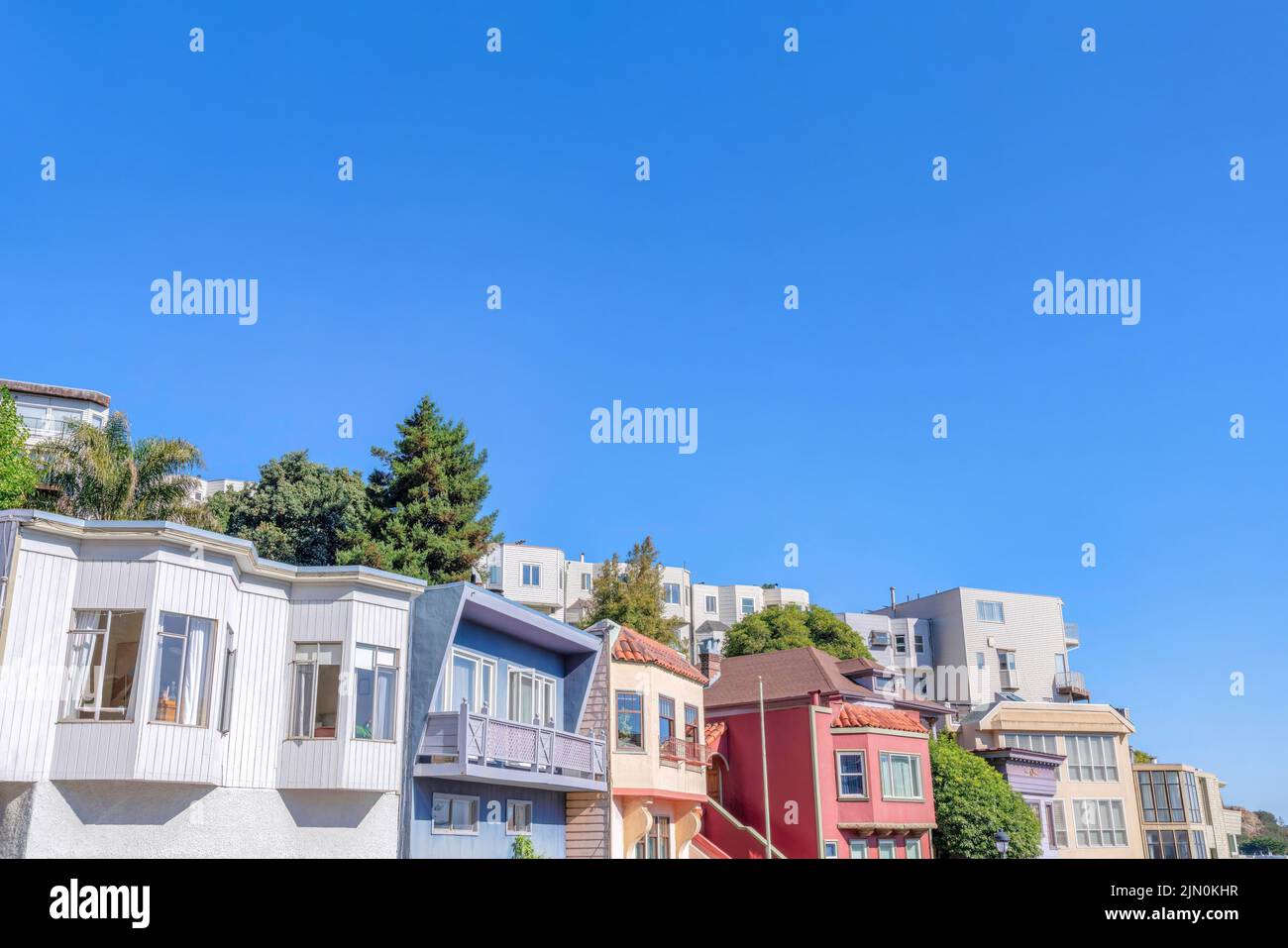 Two row of houses on a sloped neighborhood at San Francisco, California ...