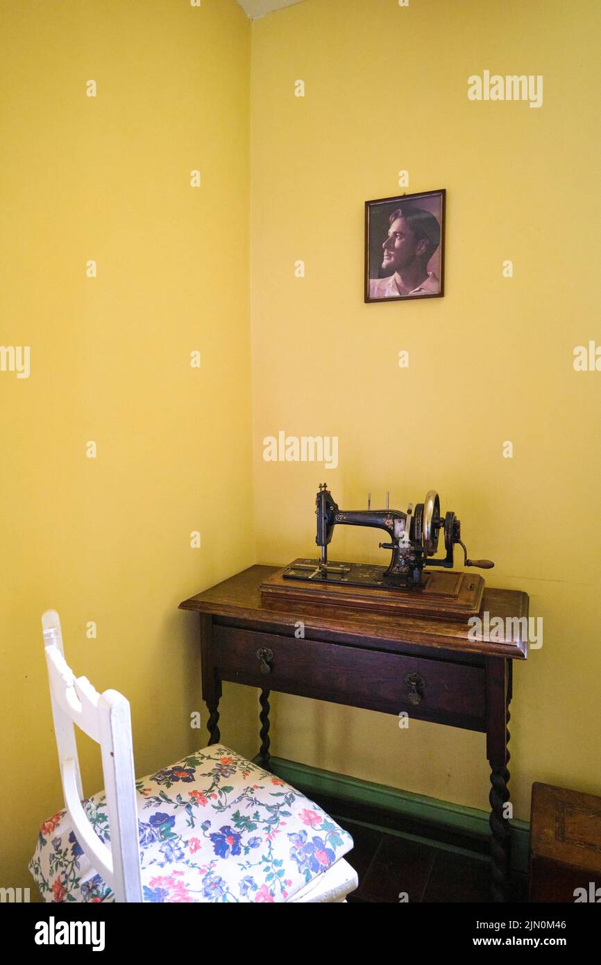 A corner of the upstairs landing made into a sewing area with machine and table. In a recreation of a typical, generic worker's house, home from 1944 Stock Photo