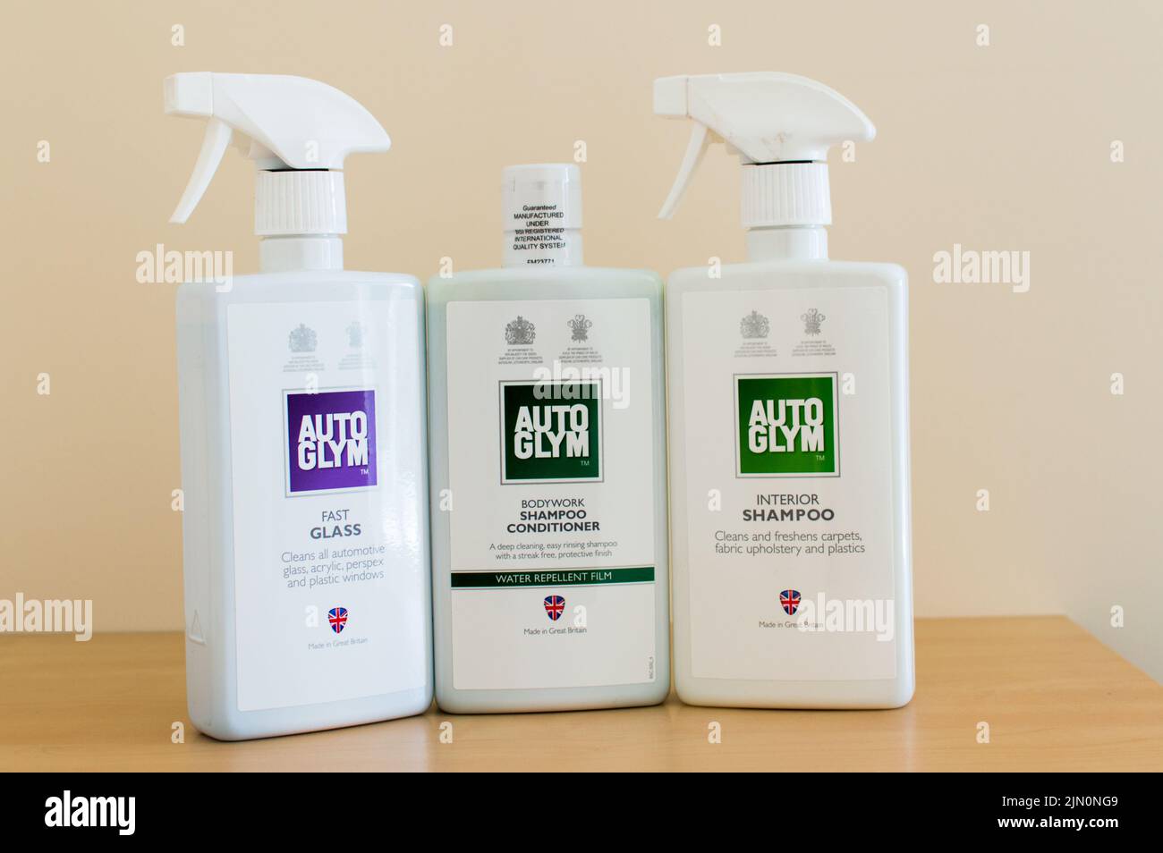 Three AutoGlym car care cleaning products on table Stock Photo