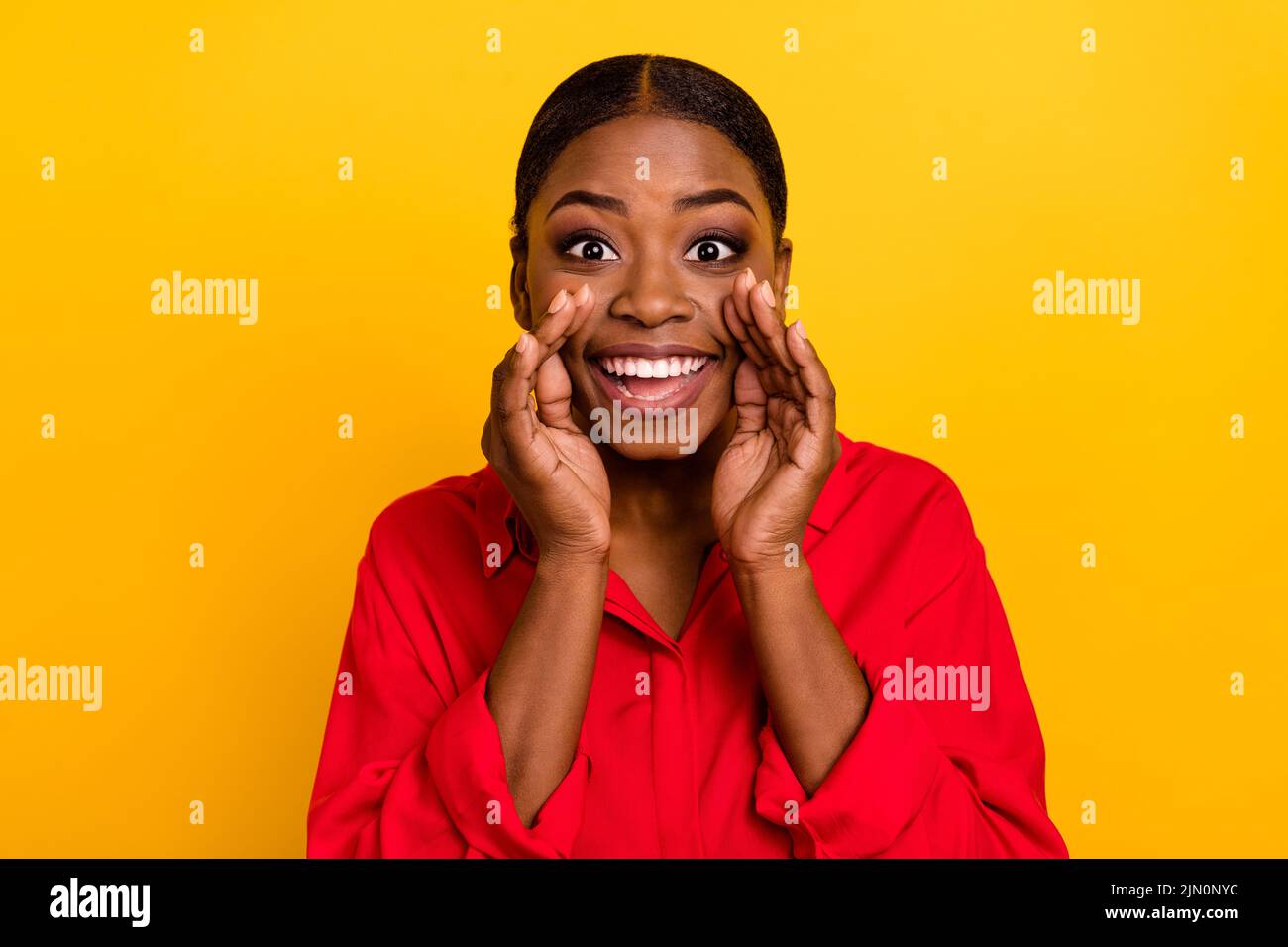 Photo of young lovely girl hands near mouth shout promoter ads information isolated over yellow color background Stock Photo