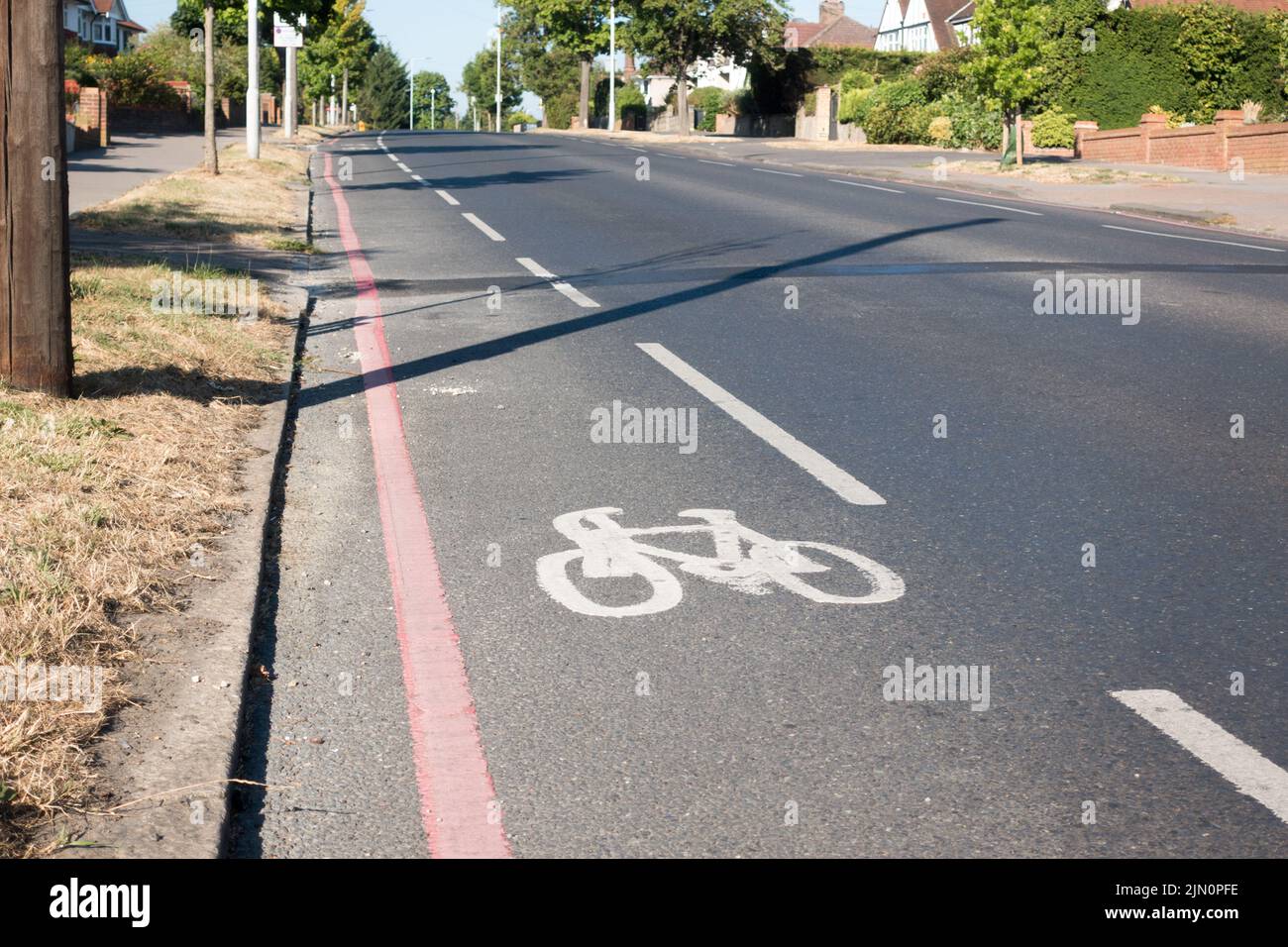 Bike lane on red route path Stock Photo