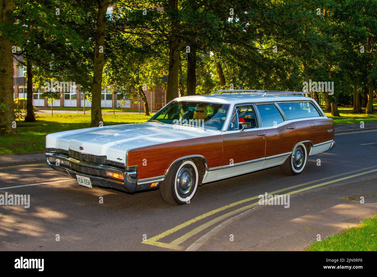 1970 70s, seventies white brown Mercury Grand Marquis automobile Wagon 7033cc Muscle Estate car; USA Cars and motorcycles on display at the 13th Lytham Hall Summer Classic Car & Motorcycle Show, a Classic Vintage Collectible Transport Festival. Stock Photo