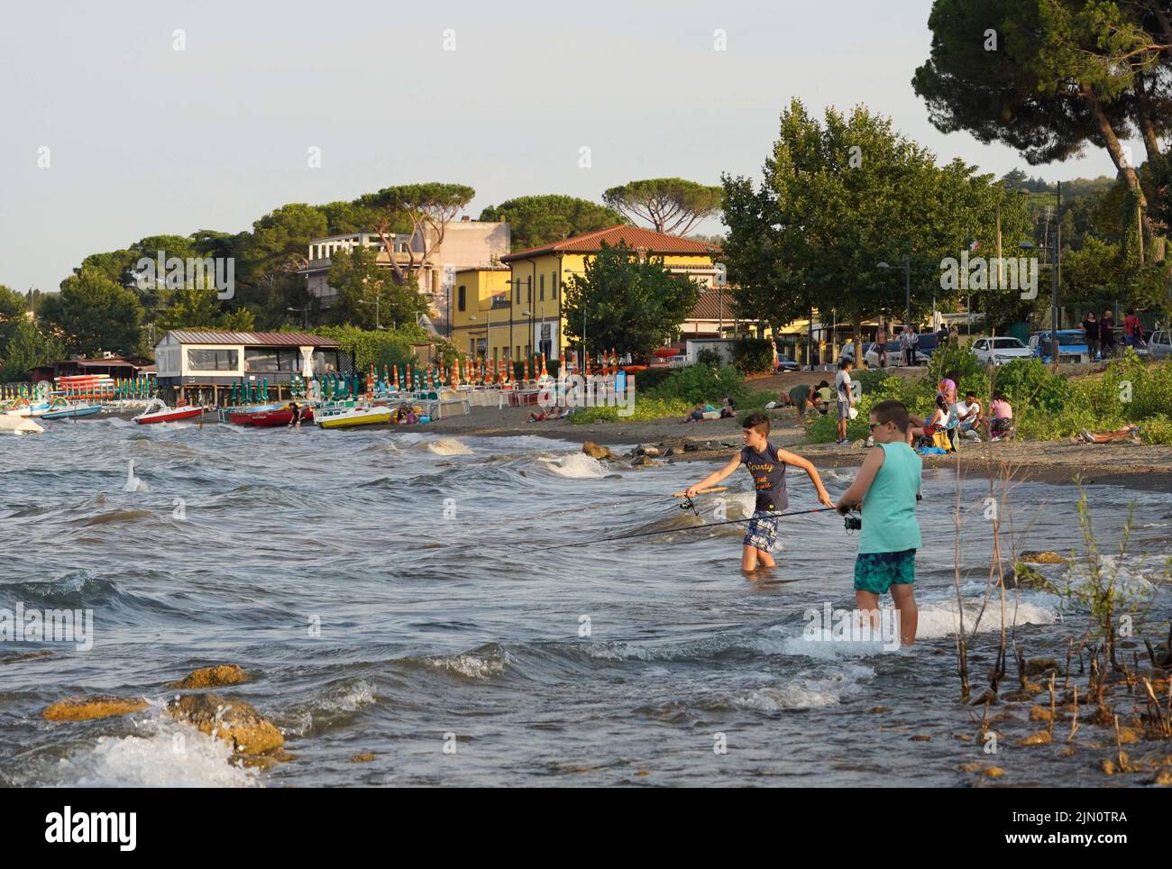 Bracciano. 7th Aug, 2022. People angle for fish in Lake Bracciano in Bracciano, Italy on Aug. 7, 2022. Credit: Jin Mamengni/Xinhua/Alamy Live News Stock Photo