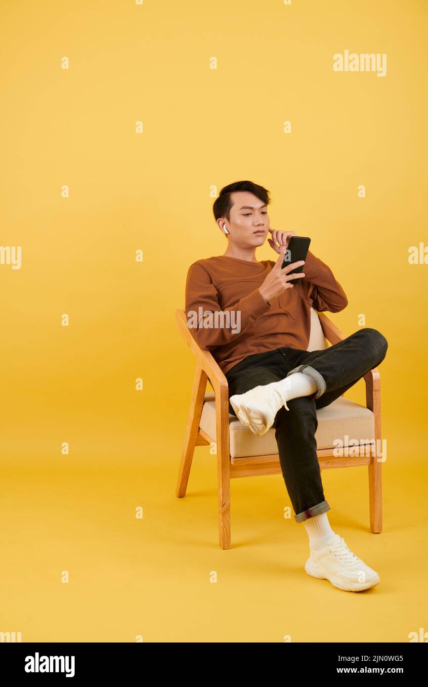 Man sitting on chair social hi-res stock photography and images - Alamy