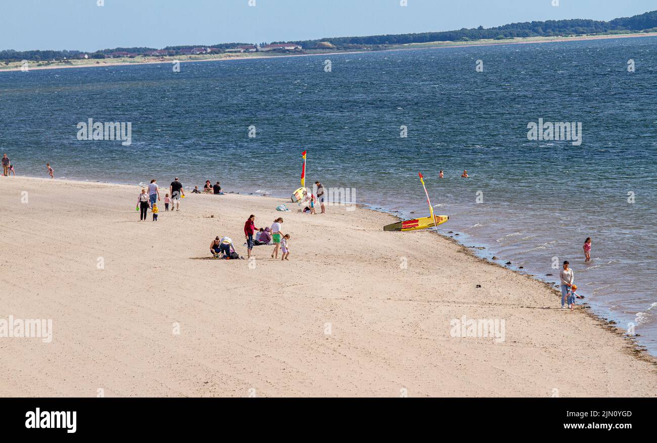 Dundee, Tayside, Scotland, UK. 8th Aug, 2022. UK Weather: A wonderful, sunny day morning with temperatures reaching 21°C in North East Scotland, but strong winds made it difficult for most people to sunbathe at Broughty Ferry. Though a few beach-goers were enjoying themselves on the beach, tourists out sightseeing along the recently constructed promenade as part of the Dundee Waterfront Development Project were not disappointed. Credit: Dundee Photographics/Alamy Live News Stock Photo