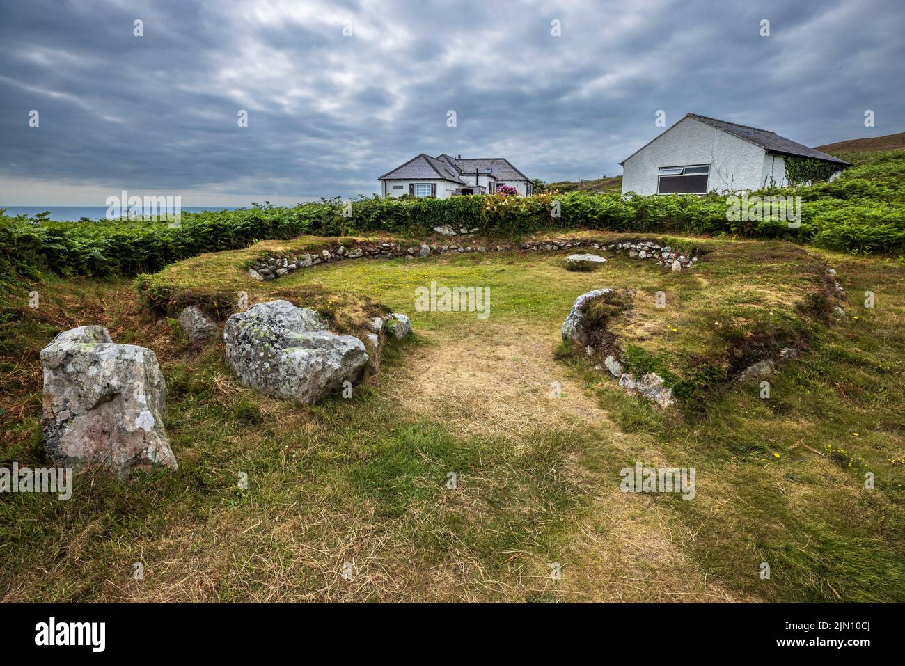The remains of an Iron Age Hut Circle near Holyhead Mountain on Holy Island, Anglesey, North Wales Stock Photo