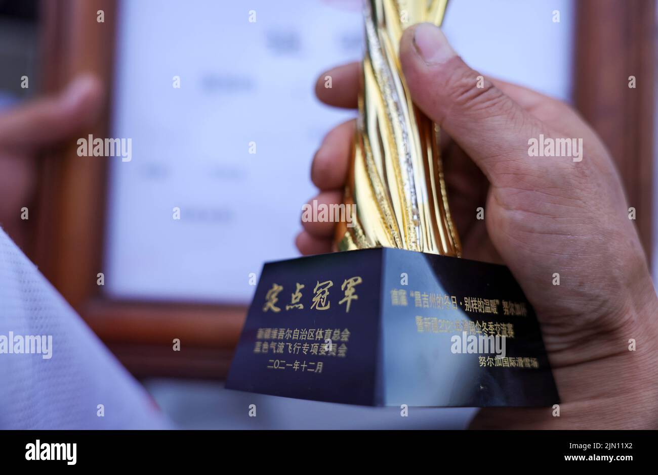 (220808) -- XINJIANG, Aug. 8, 2022 (Xinhua) -- Photo taken on June 14, 2022 shows a trophy for paragliding awarded for Chen Ruifeng. Born in Xinjiang, 52-year-old Chen Ruifeng is a paragliding amateur. He says he feels like having his own wings when the paraglider opens. In 2016, Chen Ruifeng started to practice paragliding. Later on, he joined a local club and received his flying certificate after training. As an outdoor enthusiast, he also engages himself in trail running, mountaineering and ice climbing. In his opinions, the unique terrain of Xinjiang, such as mountains, steppes and rivers, Stock Photo