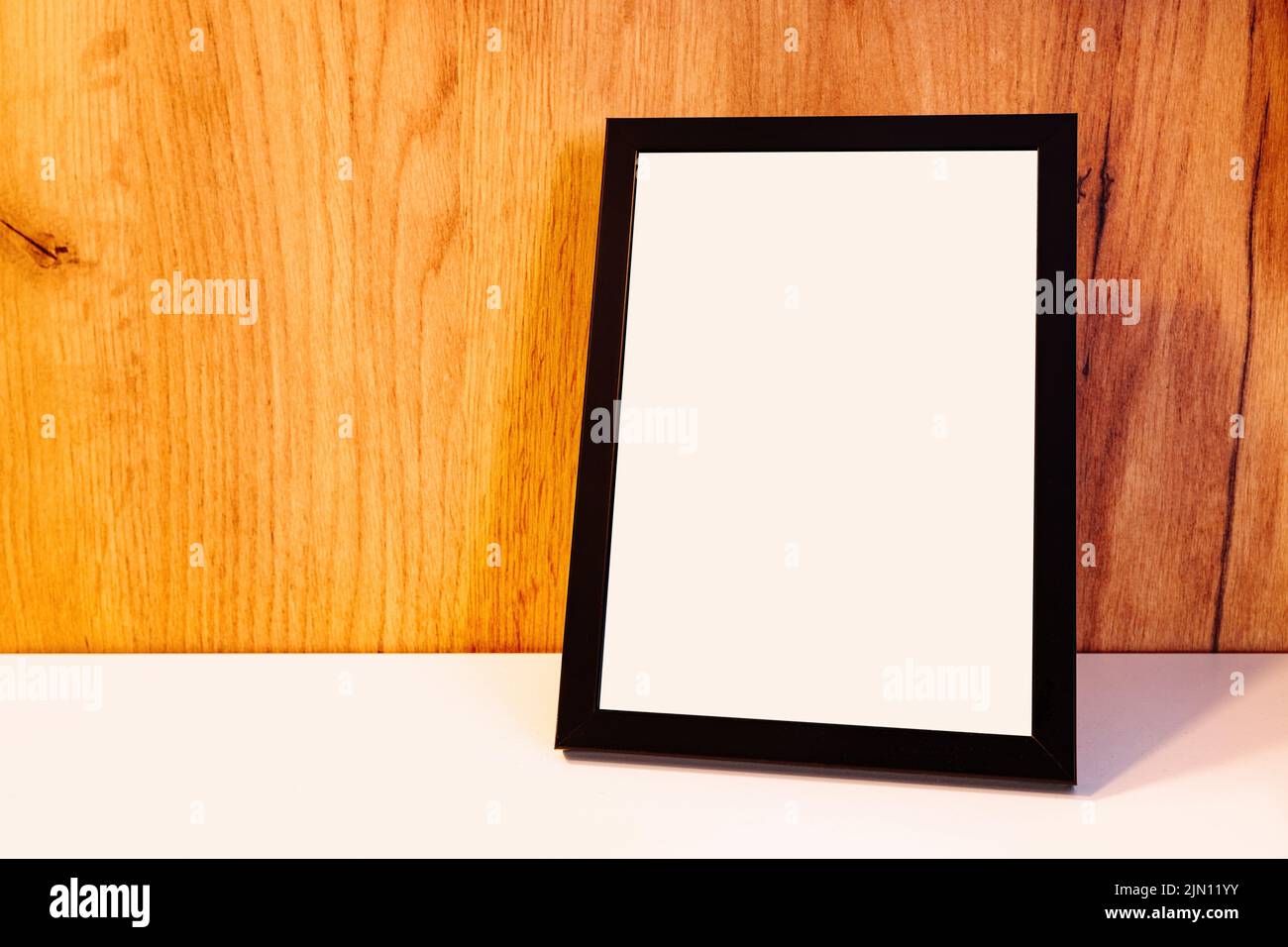 Blank picture frame on the shelf as mockup copy space for graphic or text Stock Photo