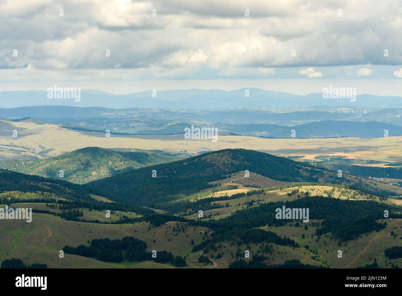 View of Zlatibor hills and valleys seen from the Tornik mountain top on sunny summer day Stock Photo