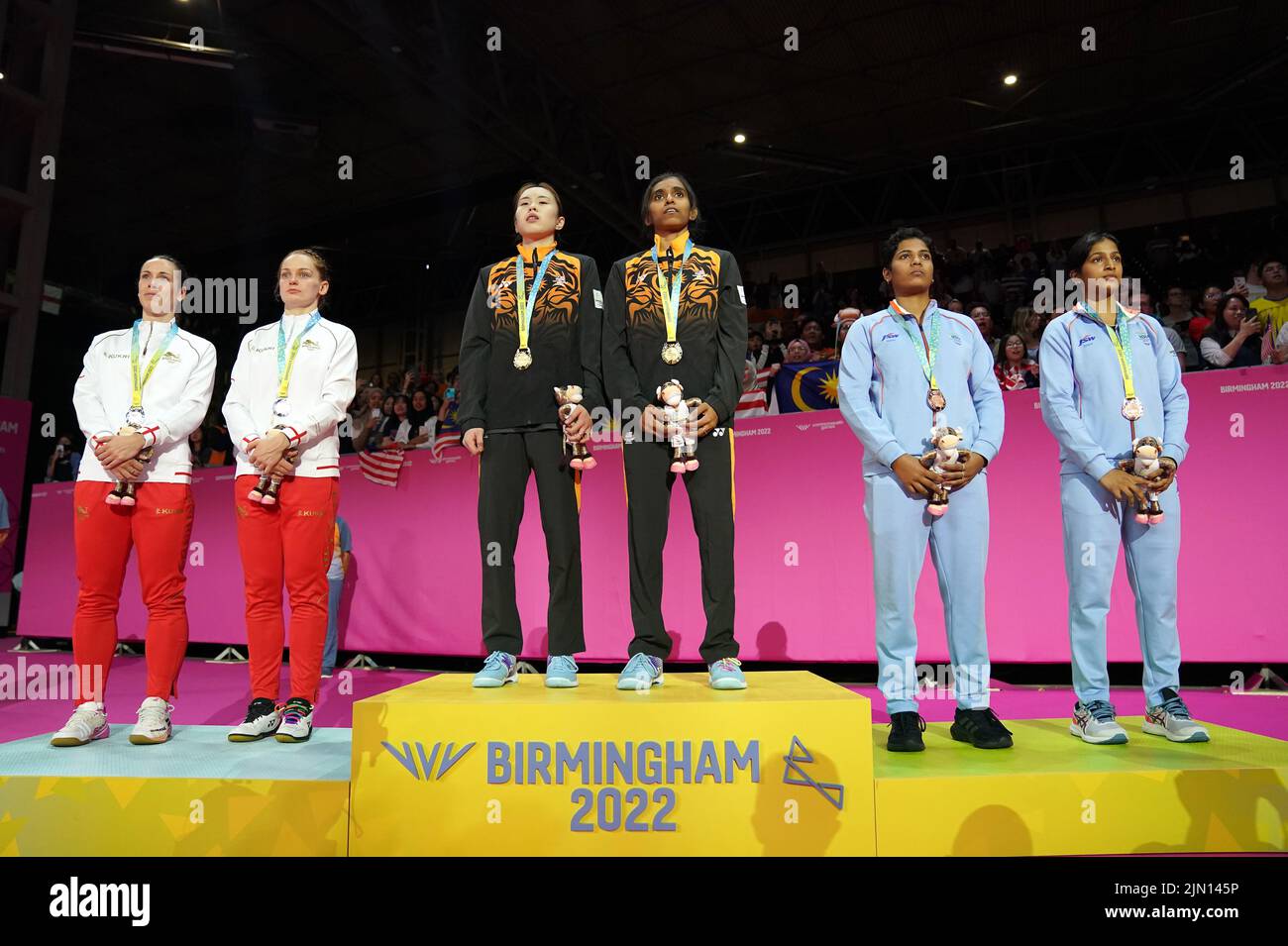 England's Chloe Birch and Lauren Smith, Malaysia's Koong Le Pearly Tan and Muralitharan Thinaah, gold, and India's Treesa Jolly and Gayatri Gopichand Pullela, bronze, after the Women's Doubles badminton at The NEC on day eleven of the 2022 Commonwealth Games in Birmingham. Picture date: Monday August 8, 2022. Stock Photo