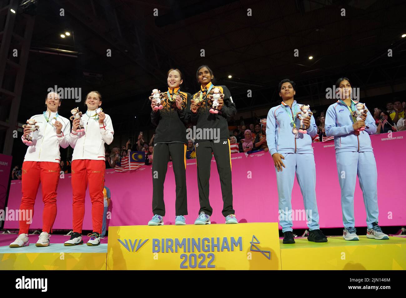 England's Chloe Birch and Lauren Smith, silver, Malaysia's Koong Le Pearly Tan and Muralitharan Thinaah, gold, and India's Treesa Jolly and Gayatri Gopichand Pullela, bronze, after the Women's Doubles badminton at The NEC on day eleven of the 2022 Commonwealth Games in Birmingham. Picture date: Monday August 8, 2022. Stock Photo