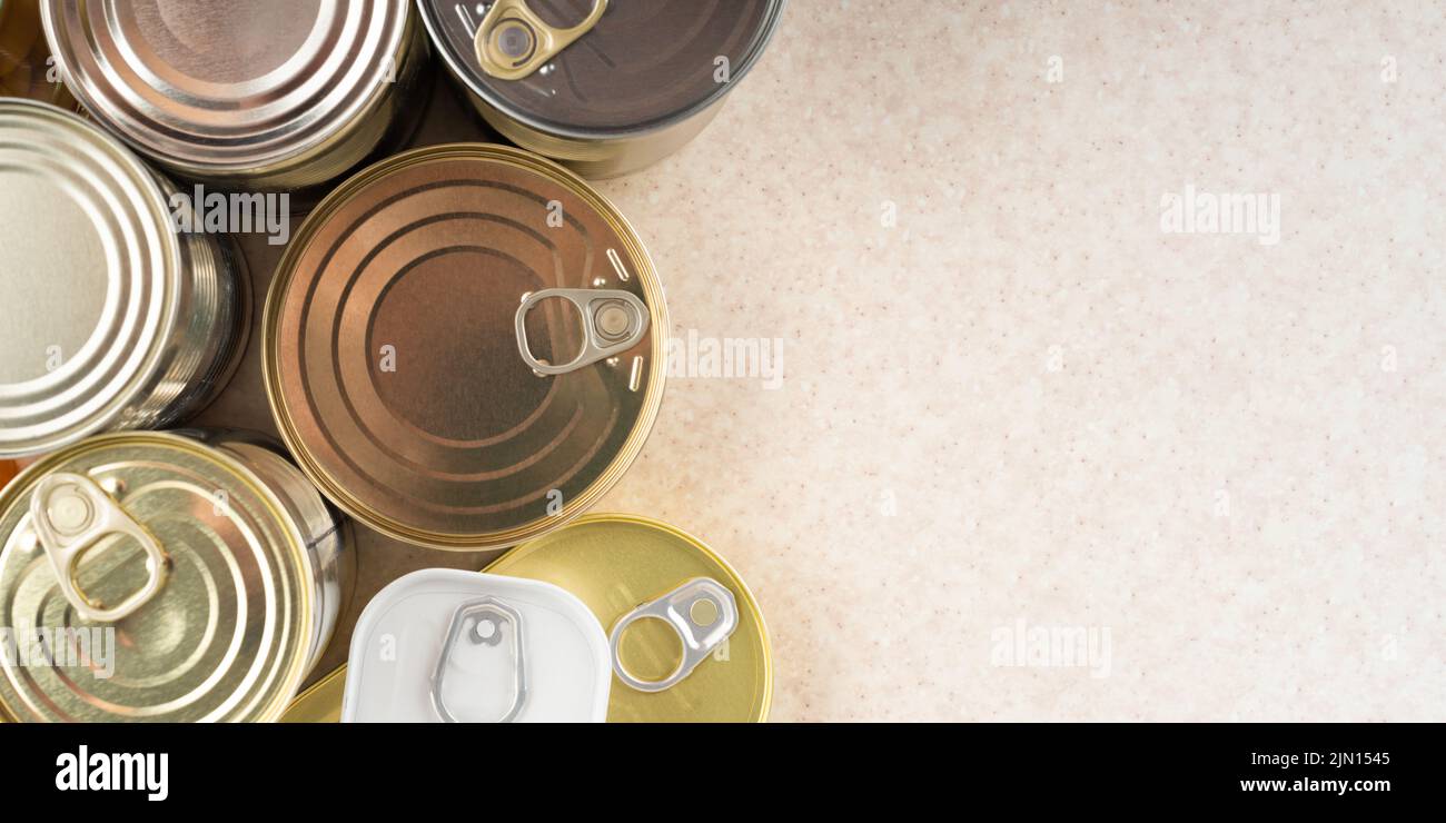 Tin cans on kitchen table background with copy space flat lay Stock Photo