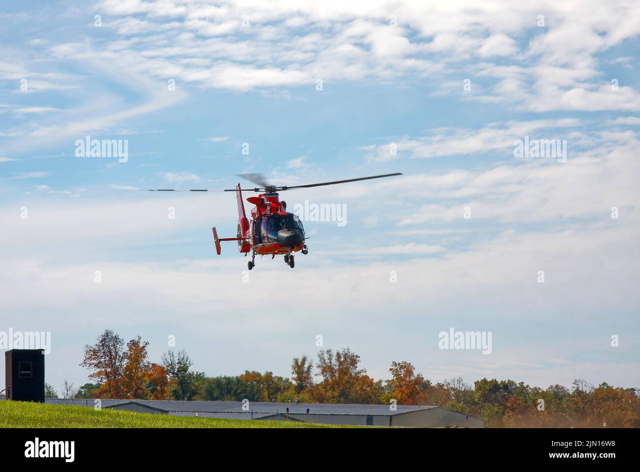 Helicopter flying, U.S. Coast Guard, rotary-wing aircraft, descending, transportation, blades rotating, motion,  Helicopter Museum; Pennsylvania; West Stock Photo