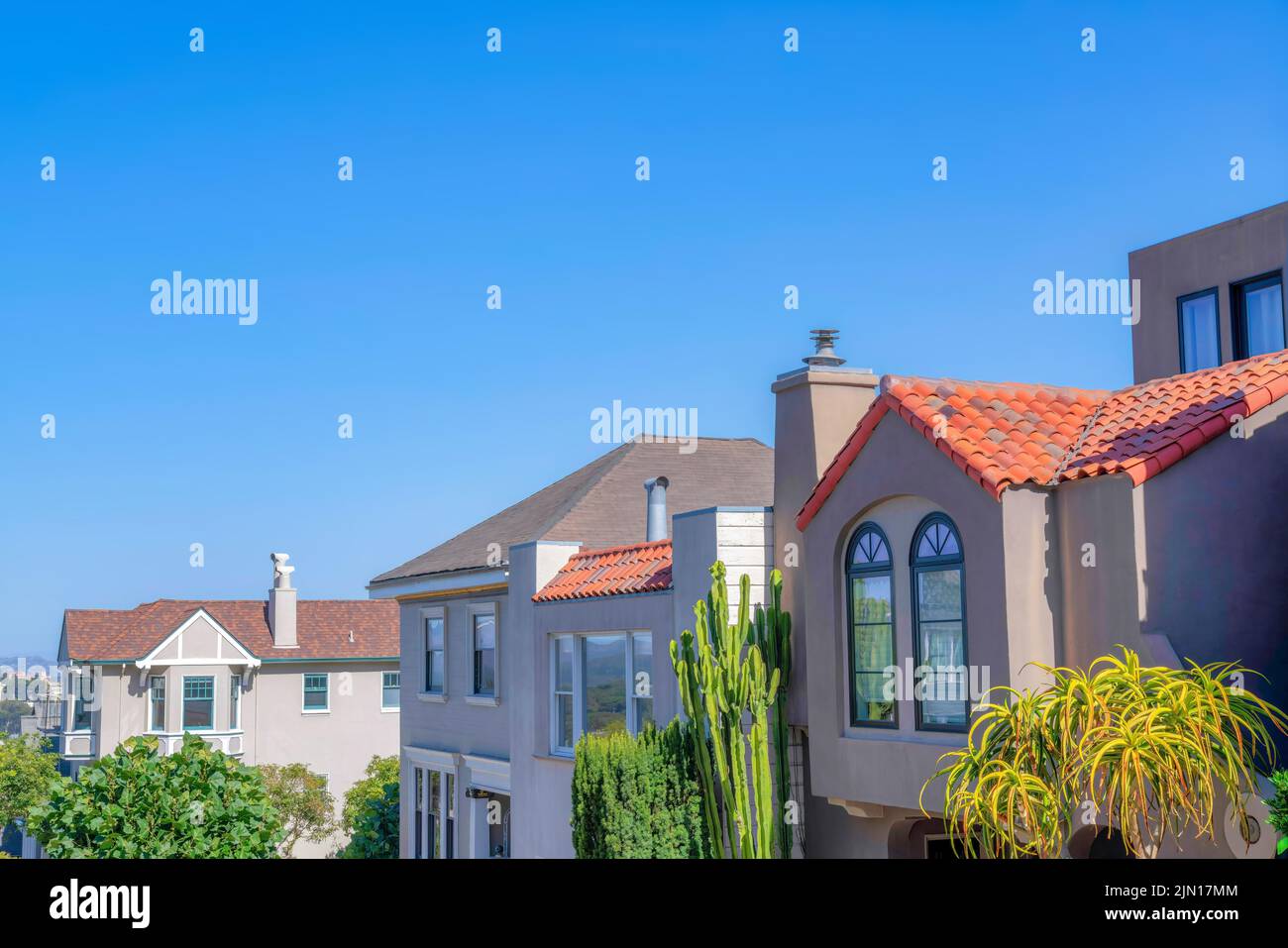 Sloped row of houses against the clear sky background at San Francisco ...
