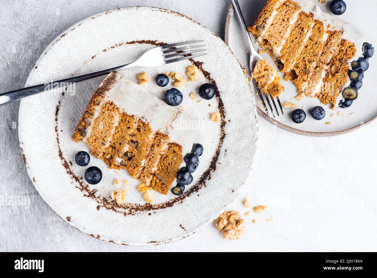 Carrot cake slice with blueberries, top view Stock Photo