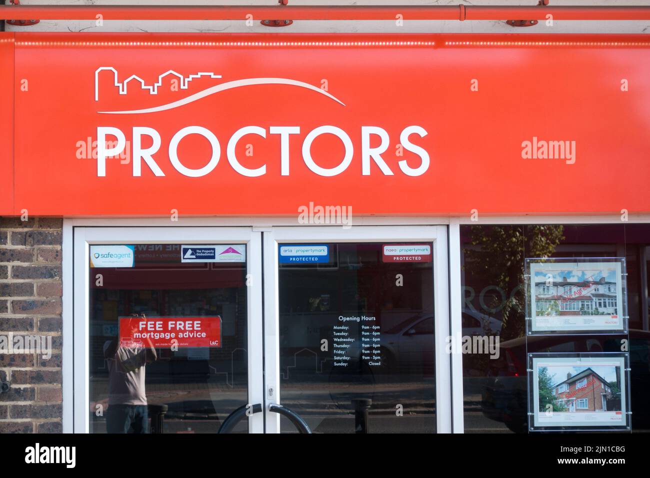 Proctors estate agent sign board Stock Photo