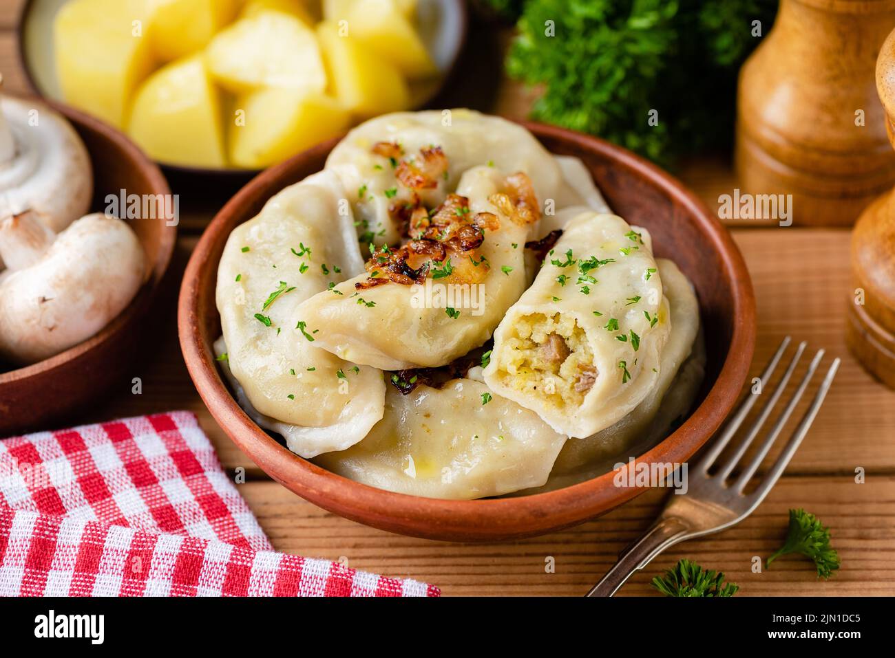 Potato mushroom stuffed vareniky, pierogi or dumplings. Ukrainian cuisine food Stock Photo