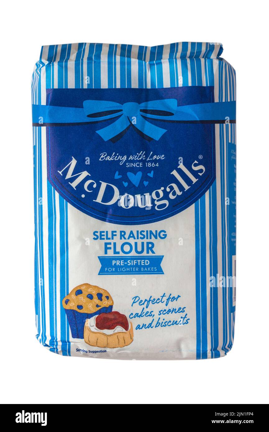 bag of McDougalls self raising flour pre-sifted for lighter bakes baking with love since 1864 isolated on white background bag of flour packet Stock Photo