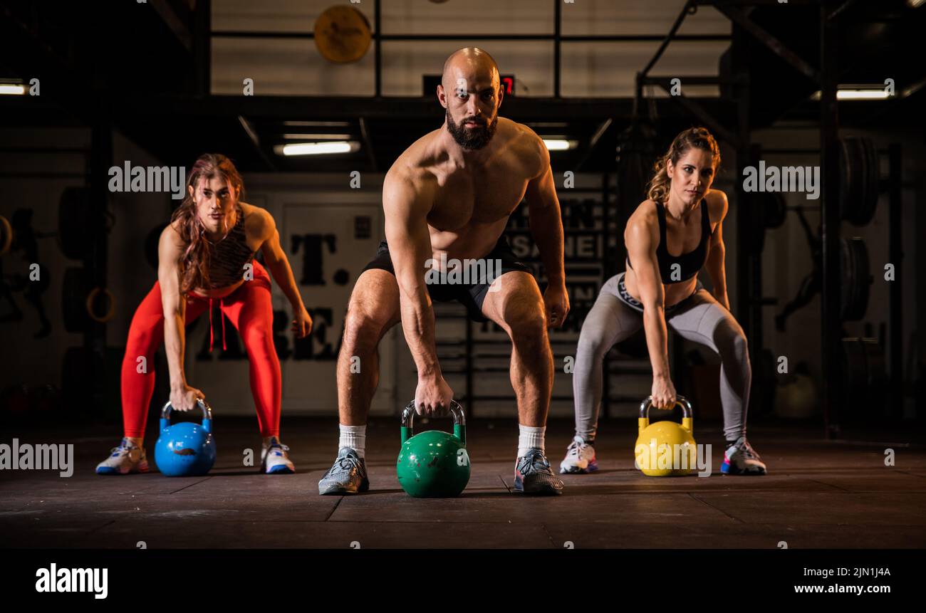 Fit Group Of People Working Out With Weights Together During An fit-group-of-people-working-out-with-weights-together-during-an