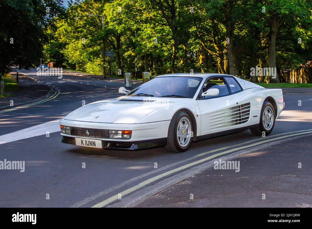 1993, 90s, nineties white FERRARI TESTAROSSA 4942 cc sports car; Collectable cars are travelling to display at the 13th Lytham Hall Summer Classic Car & Motorcycle Show, a Classic Vintage Collectible Transport Festival. Stock Photo