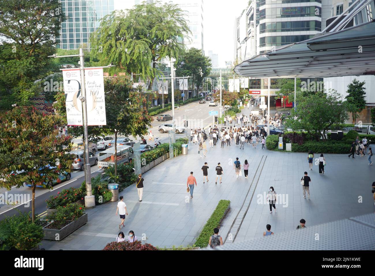 Singapore 1 june 2022. group of people crossing road in orchad road  Stock Photo