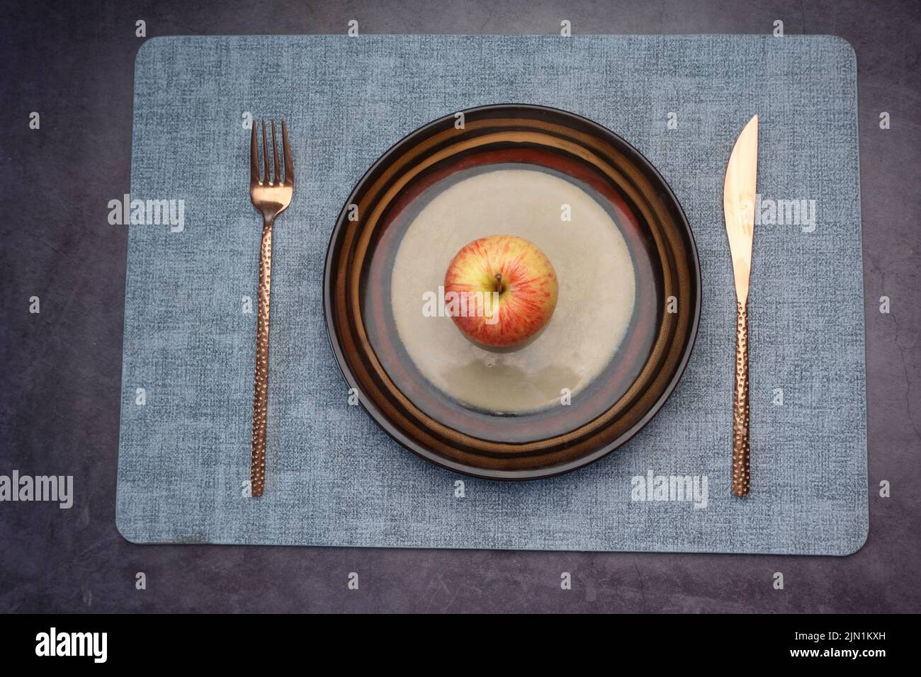cutlery and empty plate on table top view  Stock Photo