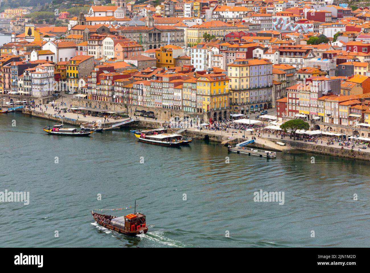 Tourist boat sailing on the River Douro in the centre of Porto a major city in northern Portugal. Stock Photo