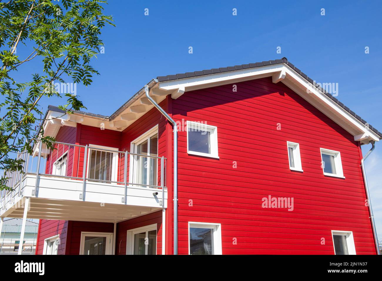 New red wooden house in Scandinavian style Stock Photo