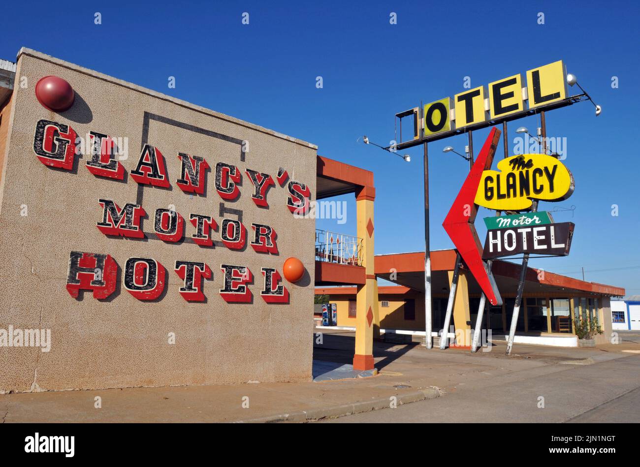 The colourful facade and classic neon sign of the Glancy Motel, built in 1939 on historic Route 66 in Clinton, Oklahoma. Stock Photo