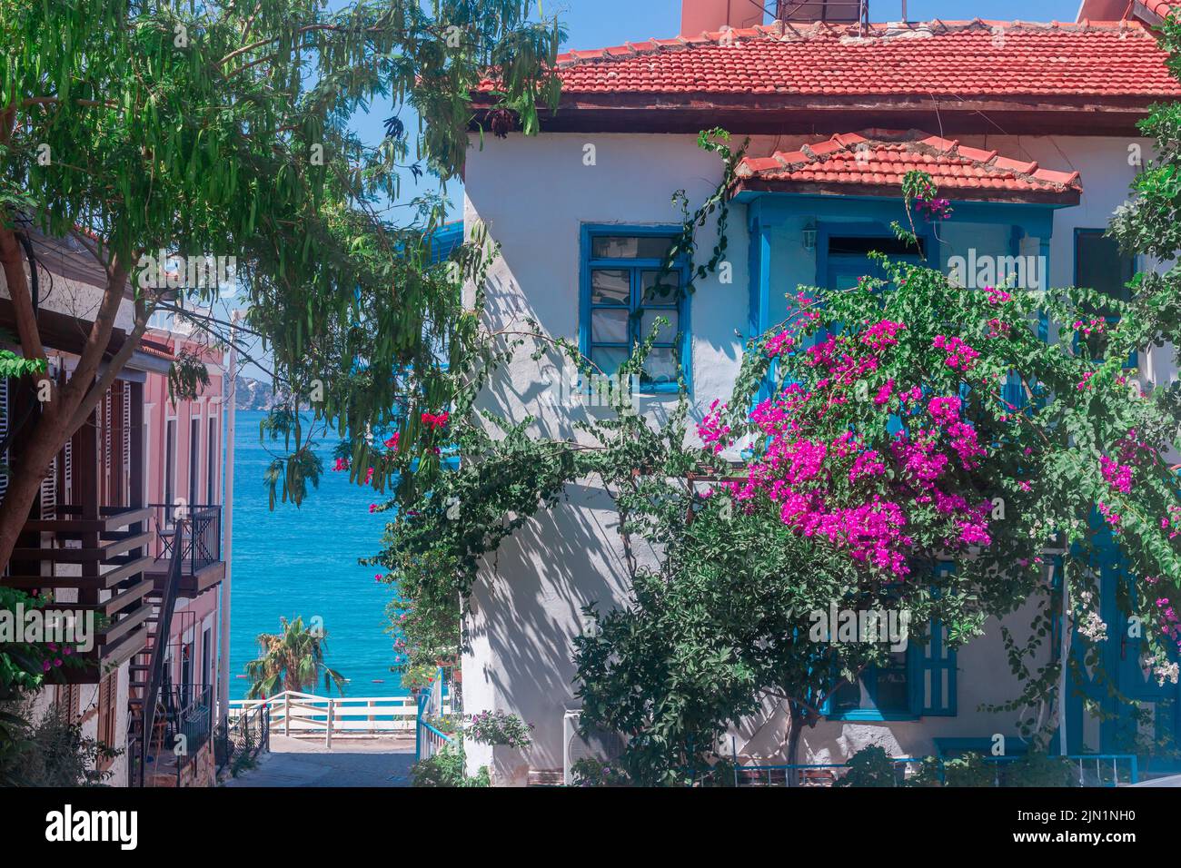 A colorful street leading to the sea, street view in Kalkan, Antalya, Turkey Stock Photo