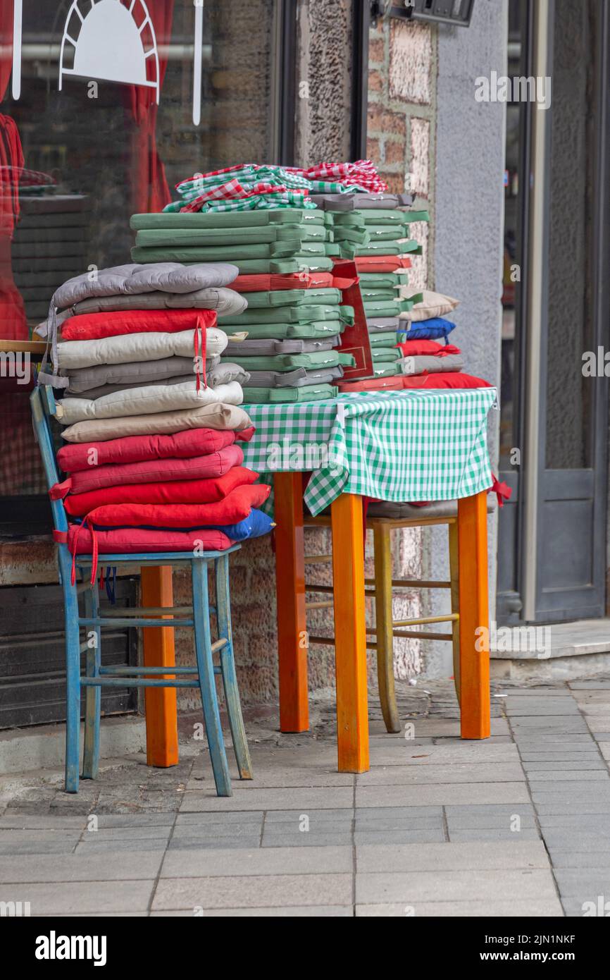 Big Pile of Colourful Dining Chairs Cushions Pads Outdoor Stock Photo