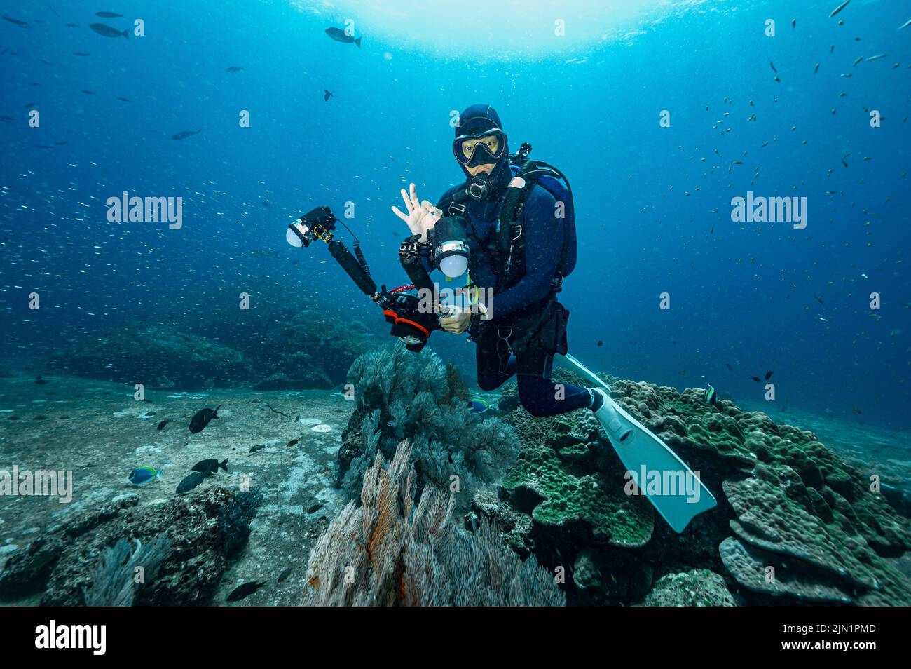 photographer takes picture at the Andaman Sea in Thailand Stock Photo