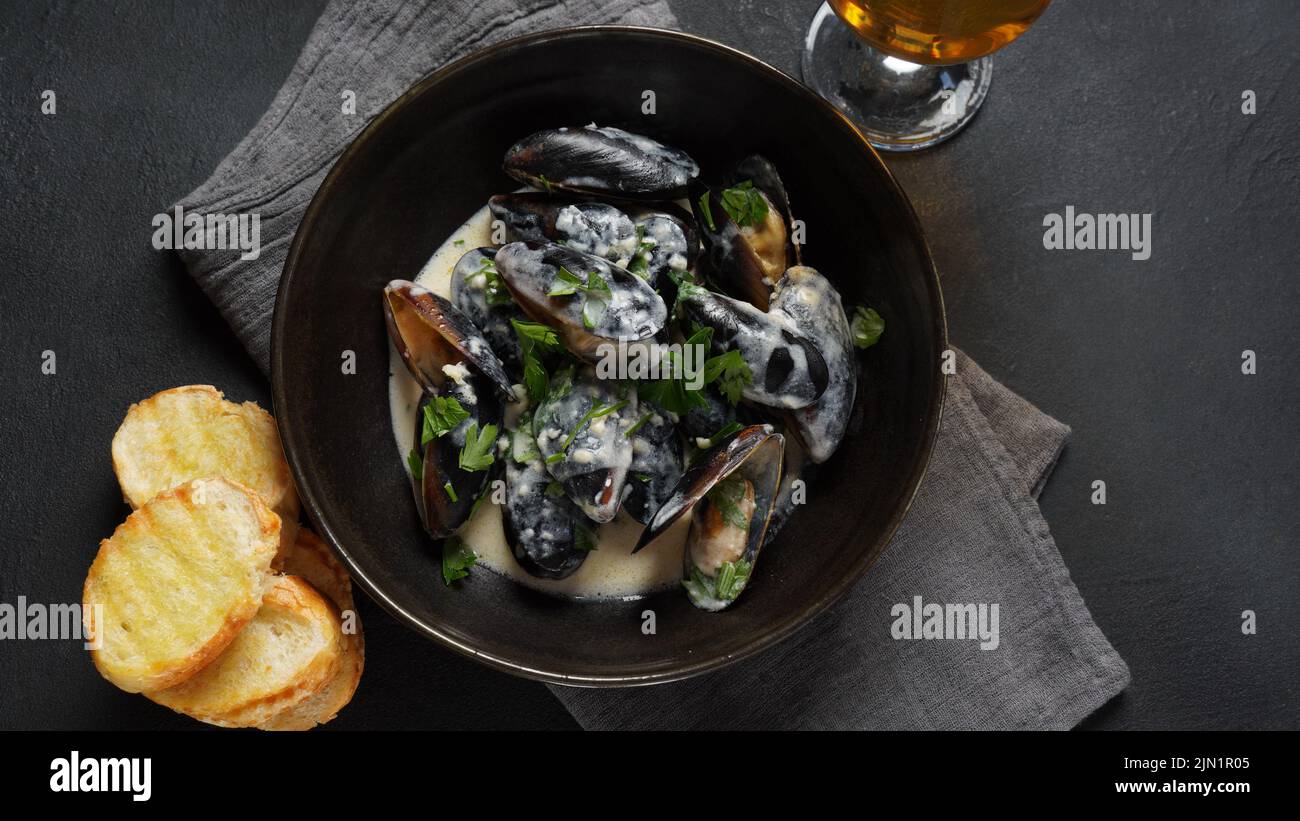 Blue mussels stewed in cream wine sauce with garlic and herbs. Italian