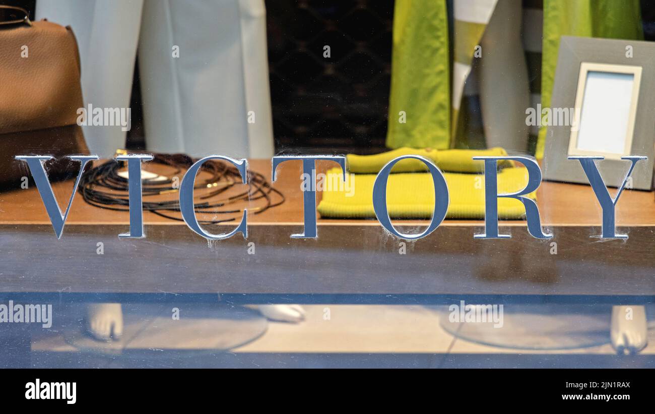 Victory 3d Letters Sign at Glass Window Stock Photo
