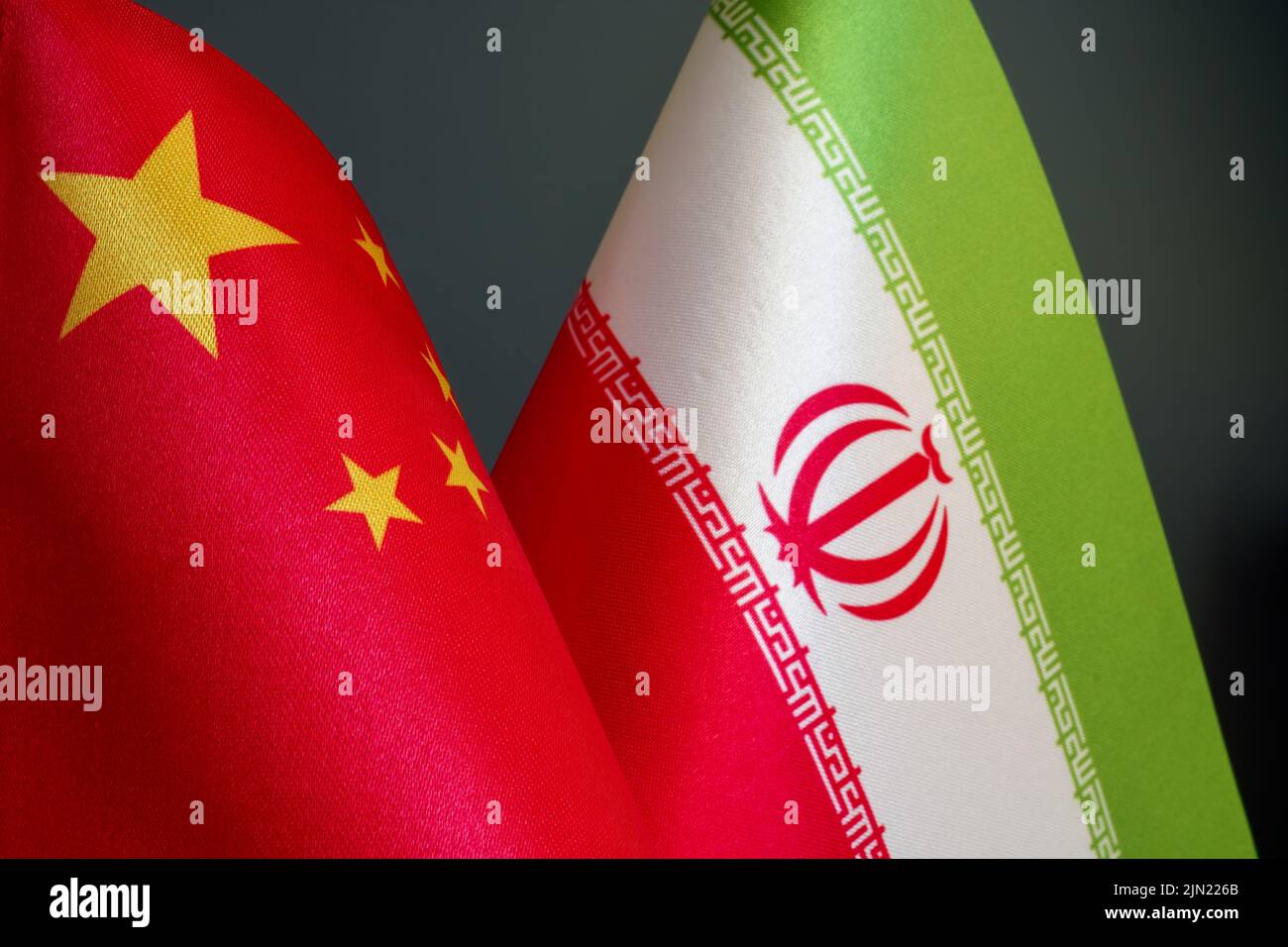 Flags of Iran and China side by side. Stock Photo