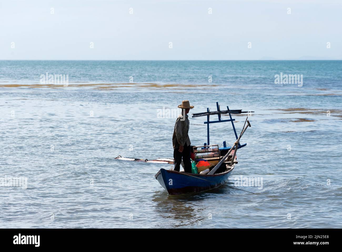 Fisherman collecting crab pots from the sea Stock Photo Alamy