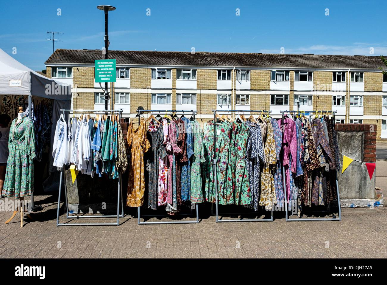 Dorking, Surrey Hills, London UK, July 07 2022, Market Stall Selling Fashionable Womens Dresses On A Clothes Hanging Rail Stock Photo