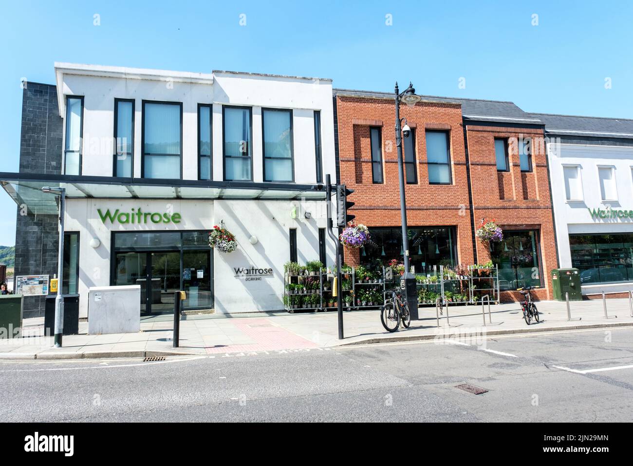 Dorking, Surrey Hills, London UK, July 07 2022, Waitrose High Street Retail Supermarket Shop Front and Sign With No People Stock Photo